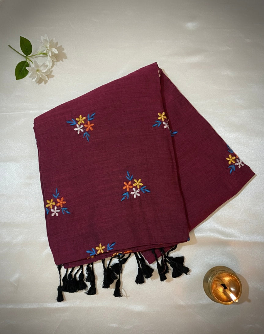 Maroon Handloom Cotton Saree with Floral Embroidery and Black Tassel Border