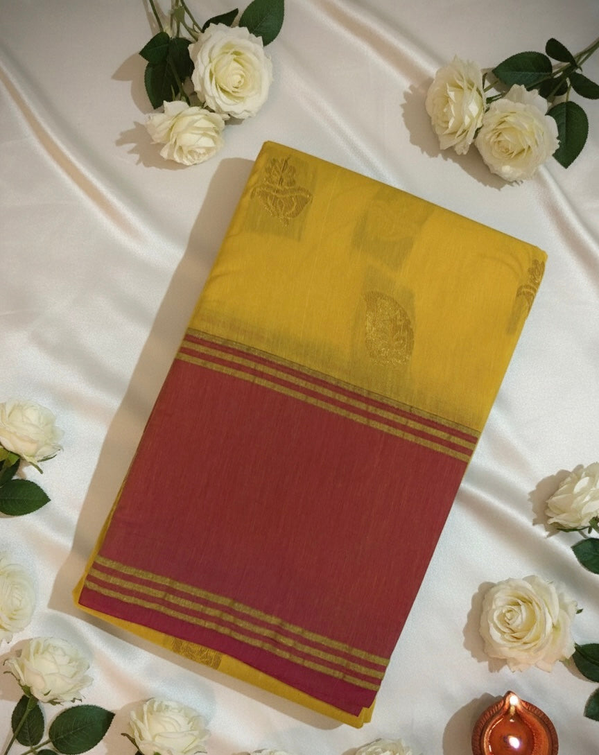 Yellow Premium Cotton Silk Saree with Pink Border and Traditional Motifs