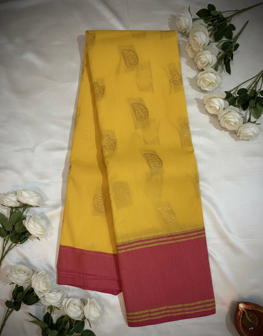 Yellow Premium Cotton Silk Saree with Pink Border and Traditional Motifs