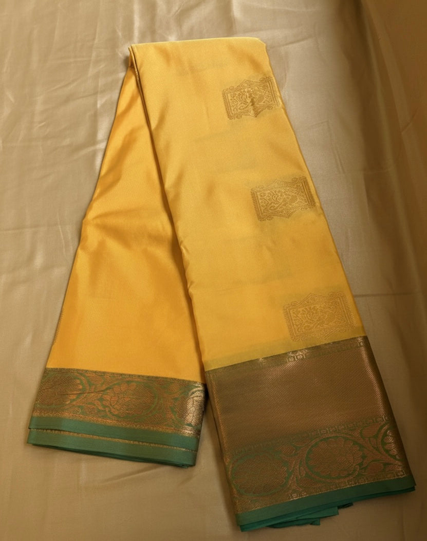 Yellow Kanjivaram Silk Saree with Green Golden Border and Temple Motifs